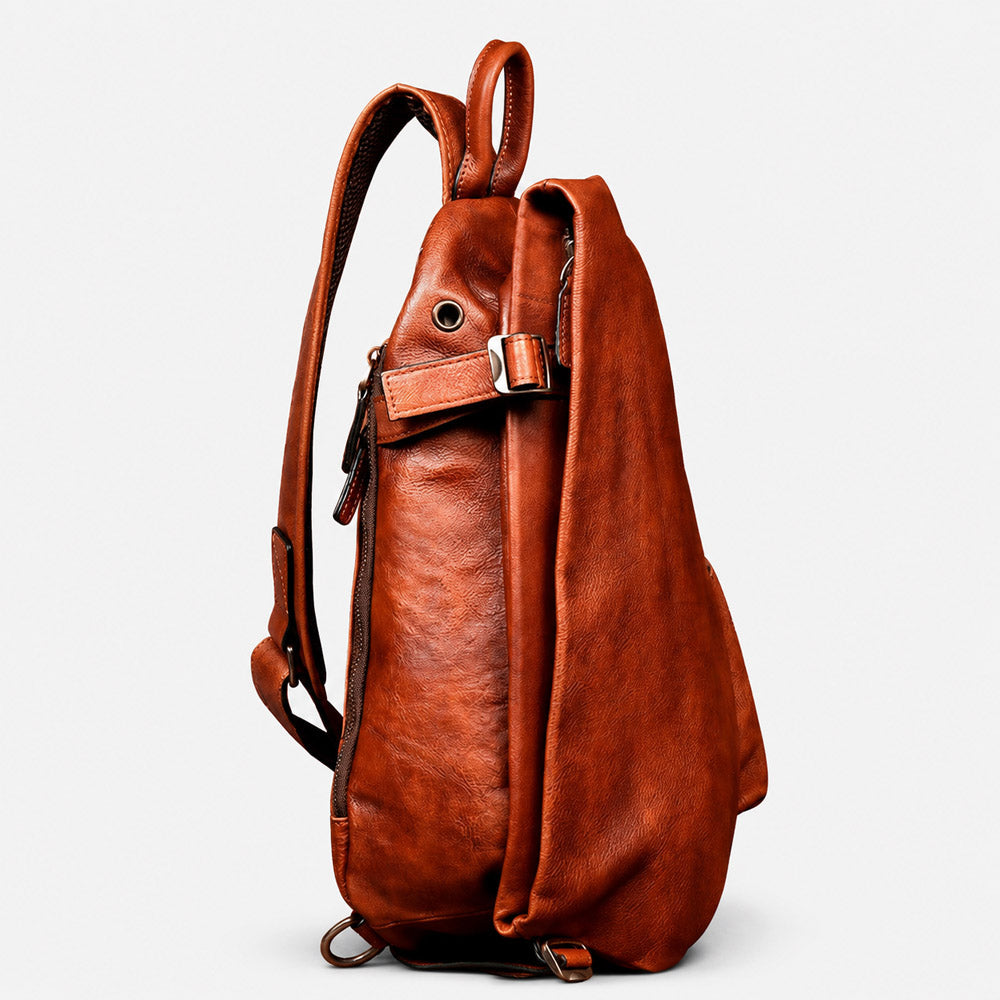 Side profile of large-capacity brown leather waist pack showing 13cm depth, curved body, and adjustable shoulder strap