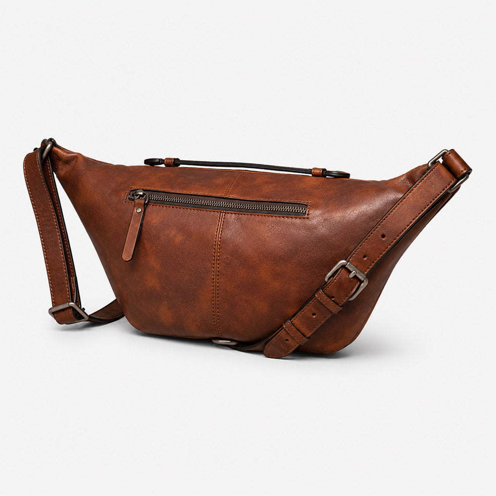 Side profile of vintage leather mens bum bag showing slim 8cm depth, curved body structure, and adjustable strap