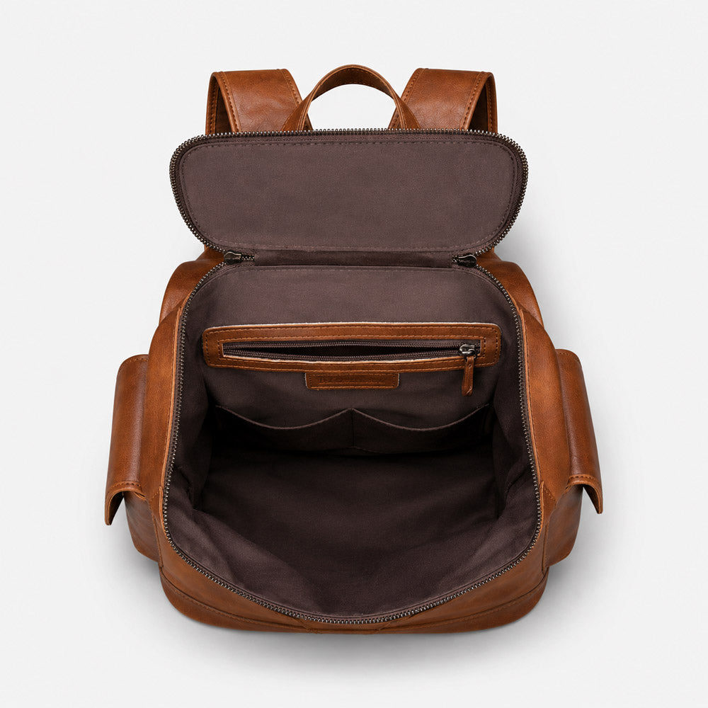 mens leather backpack features multiple storage compartments